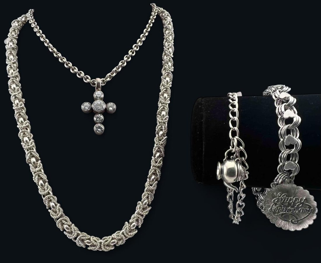 Sterling Silver Necklaces & Charm Bracelets: Sterling Silver Necklaces & Charm Bracelets, 161.7g. Marked "sterling," or "925." Cross necklace signed "Kalibre." Largest necklace length approximately 24.0in. Width approximately 7.0mm. Bracelets ap