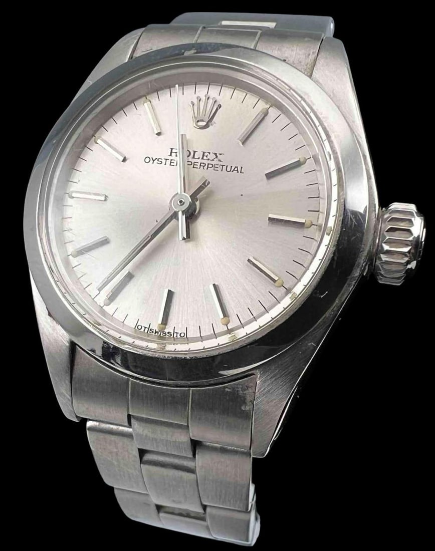 Rolex Oyster Perpetual Ladies Wristwatch: Rolex Oyster Perpetual Ladies Watch. Face marked "Rolex Oyster Perpetual. Swiss." Rolex stainless steel watch band. Width of watch to dial approximately 1.08in. Face approximately 0.77in. Inner circum