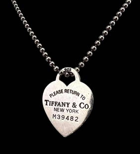 Tiffany & Co. Sterling Silver Heart Necklace: Tiffany & Co. Sterling Silver Heart Necklace, 22.3g. Chain and pendant marked "Tiffany & Co. 925." Pendant approximately 1.1875 x 0.875in. Chain length approximately 34.25in.