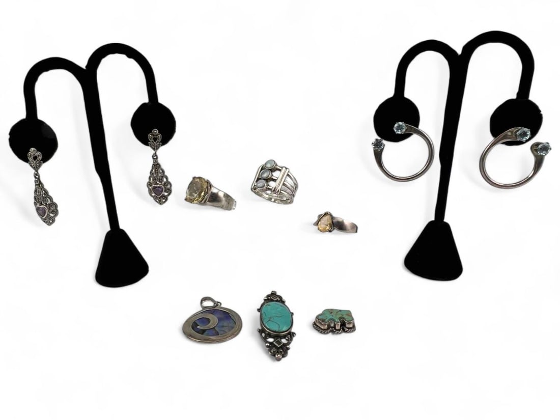 Lot Of Sterling Silver Jewelry Including Amethyst & Topaz: Lot Of Sterling Silver Jewelry Including Amethyst & Topaz, 48.6g. Marked or test as sterling. Approximate ring sizes 7-9.