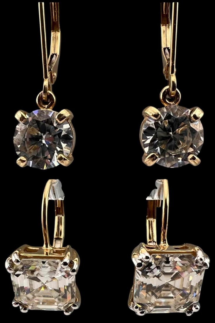 Two Pairs 14K Moissanite Earrings: Two Pairs 14K Moissanite Earrings, 5.5g. Marked 14K, 14K P. Moissanite approximately 7.9mm and 6.9mm. ALL CREDIT CARDS WILL BE MANUALLY VERIFIED PRIOR TO SHIPMENT.