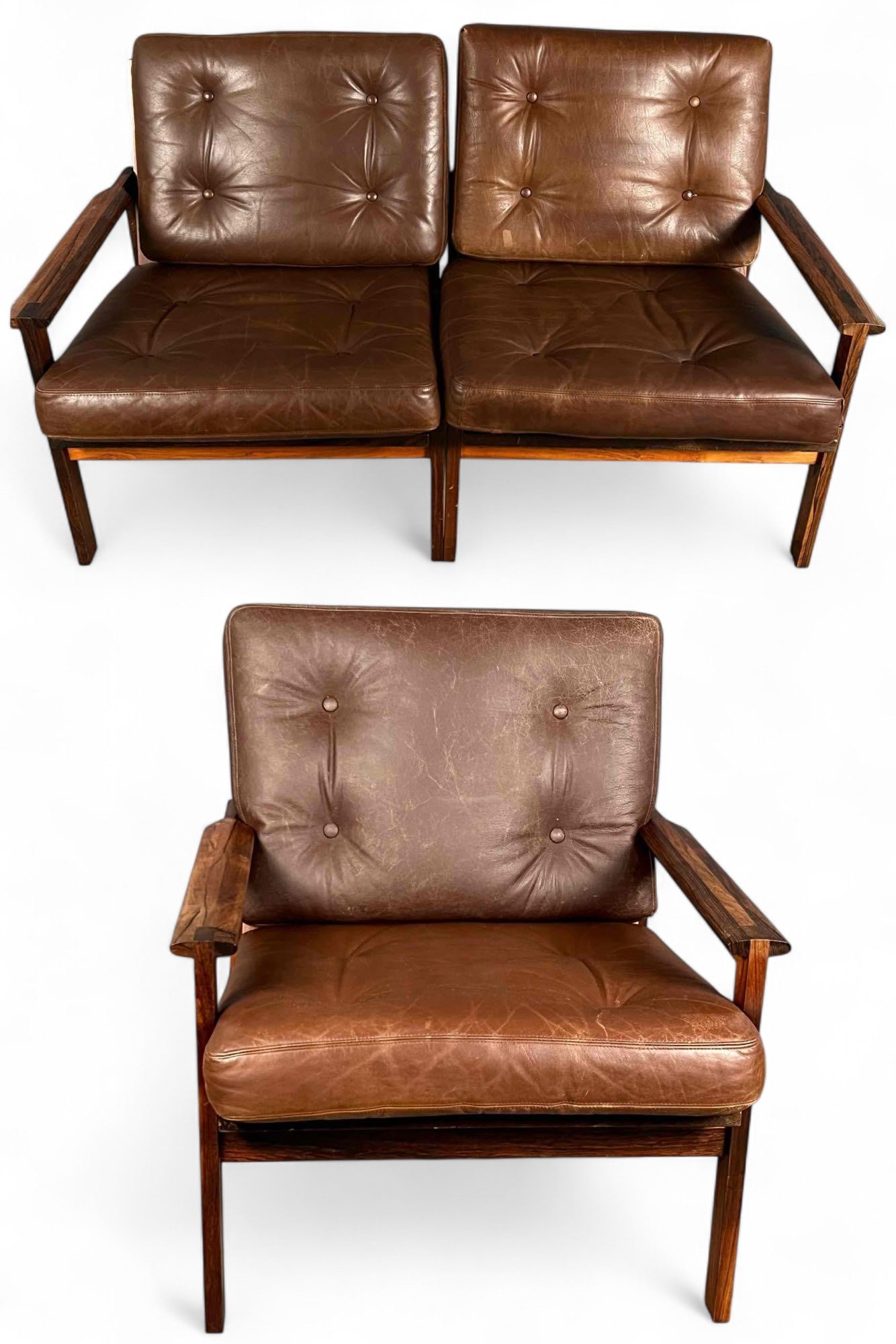 Kristian Illum Wikkelso For Niels Eilersen, Capella Danish Modern Rosewood & Leather Set: Kristian Illum Wikkelso For Niels Eilersen, Capella Danish Modern Rosewood & Leather Arm Chair And Sofa. Chair approximately 30.5H x 27.0W in. Loveseat approximately 30.5H x 52.0W in.