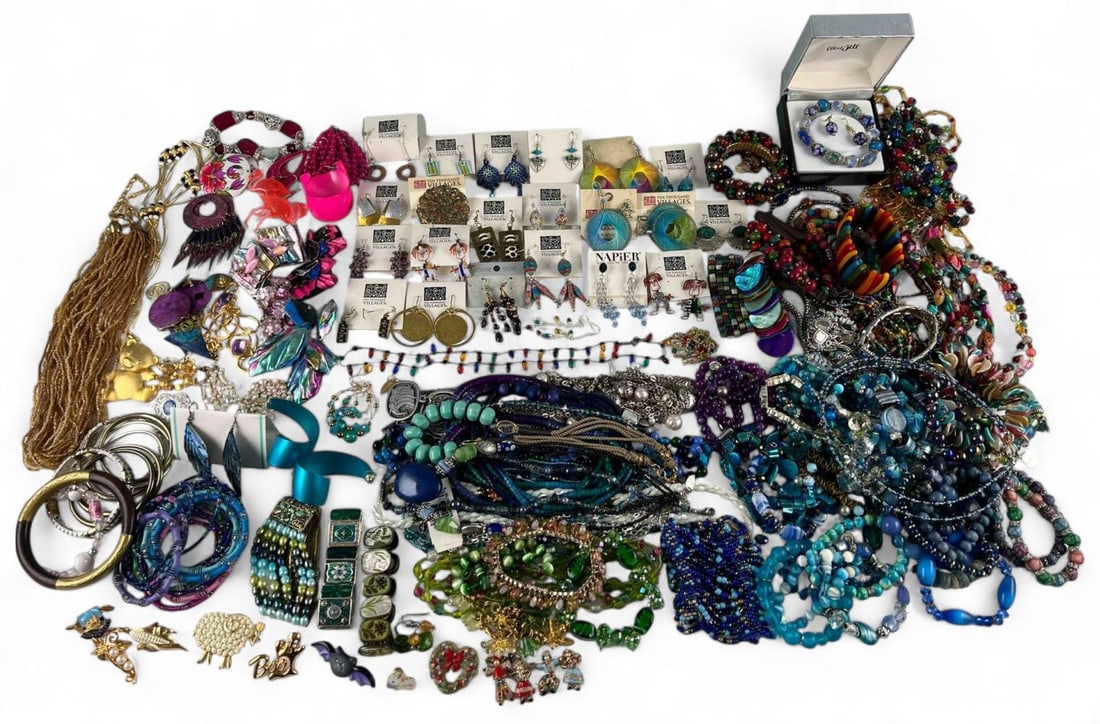 Large Lot Of Colorful Costume Jewelry: Large Lot Of Colorful Costume Jewelry. Includes necklaces, bracelets, brooches, earrings, beads, and more.