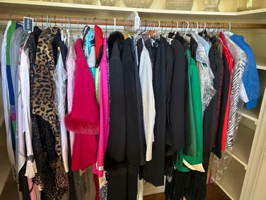 Closet Filled With Clothes And Shoes