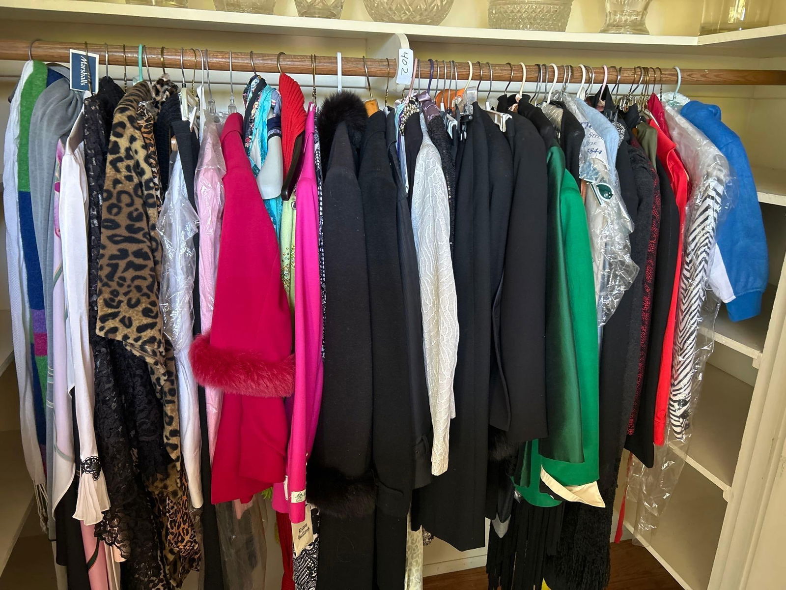 Closet Filled With Clothes And Shoes (1 of 2)