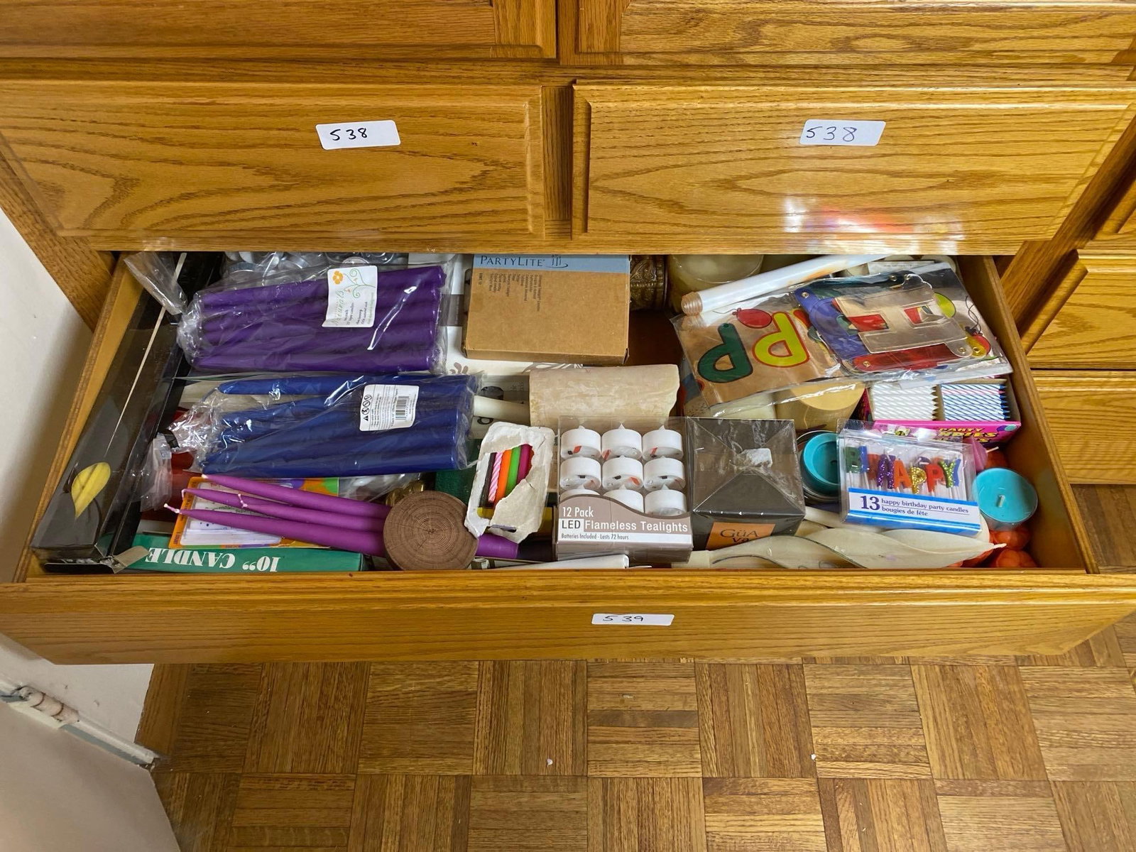 Drawer Of Birthday Supplies, Candles And Banners: Drawer of Birthday Supplies, Candles and Banners.