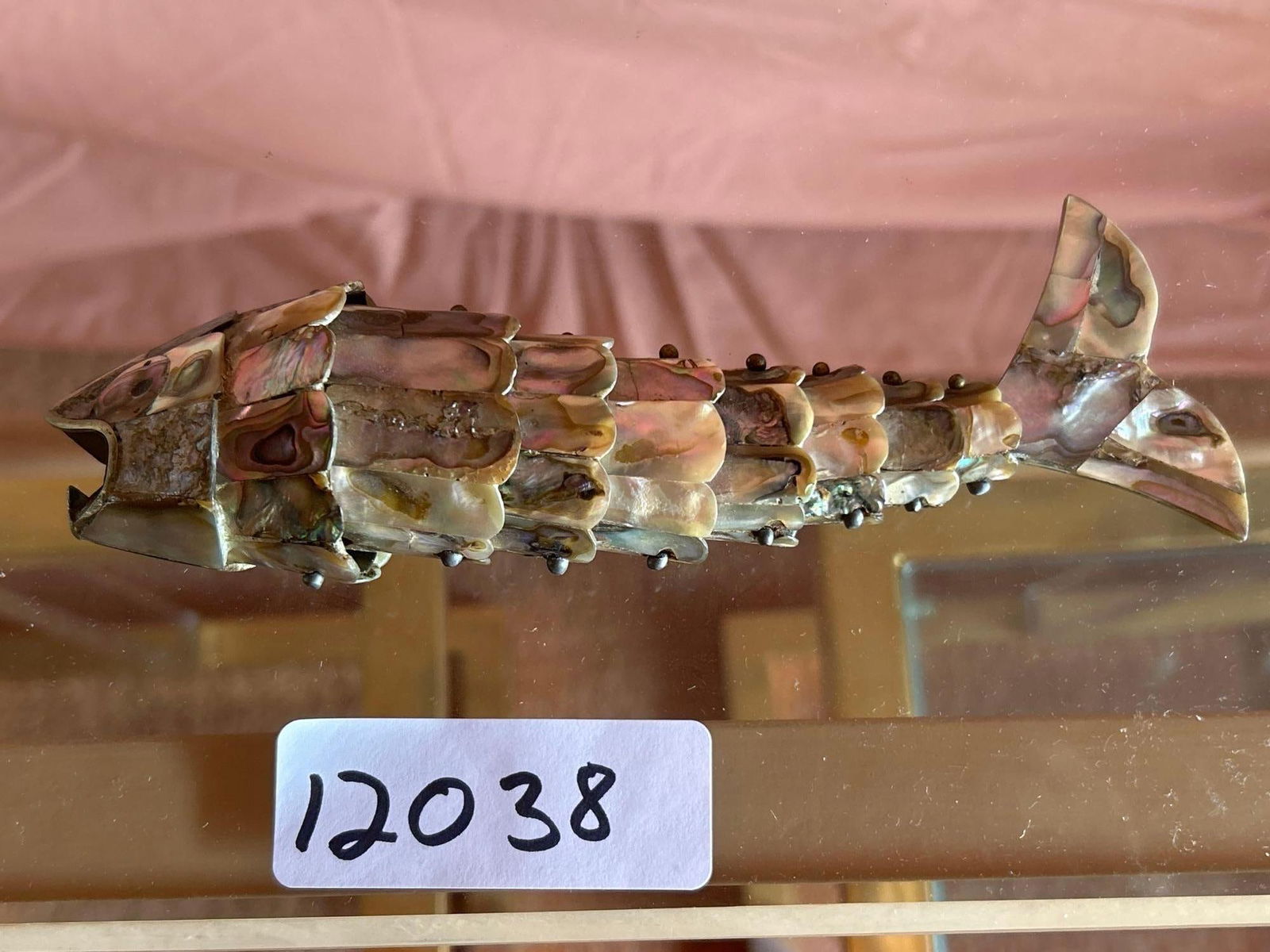 Abalone Articulated Fish Bottle Opener: Abalone articulated fish bottle opener.