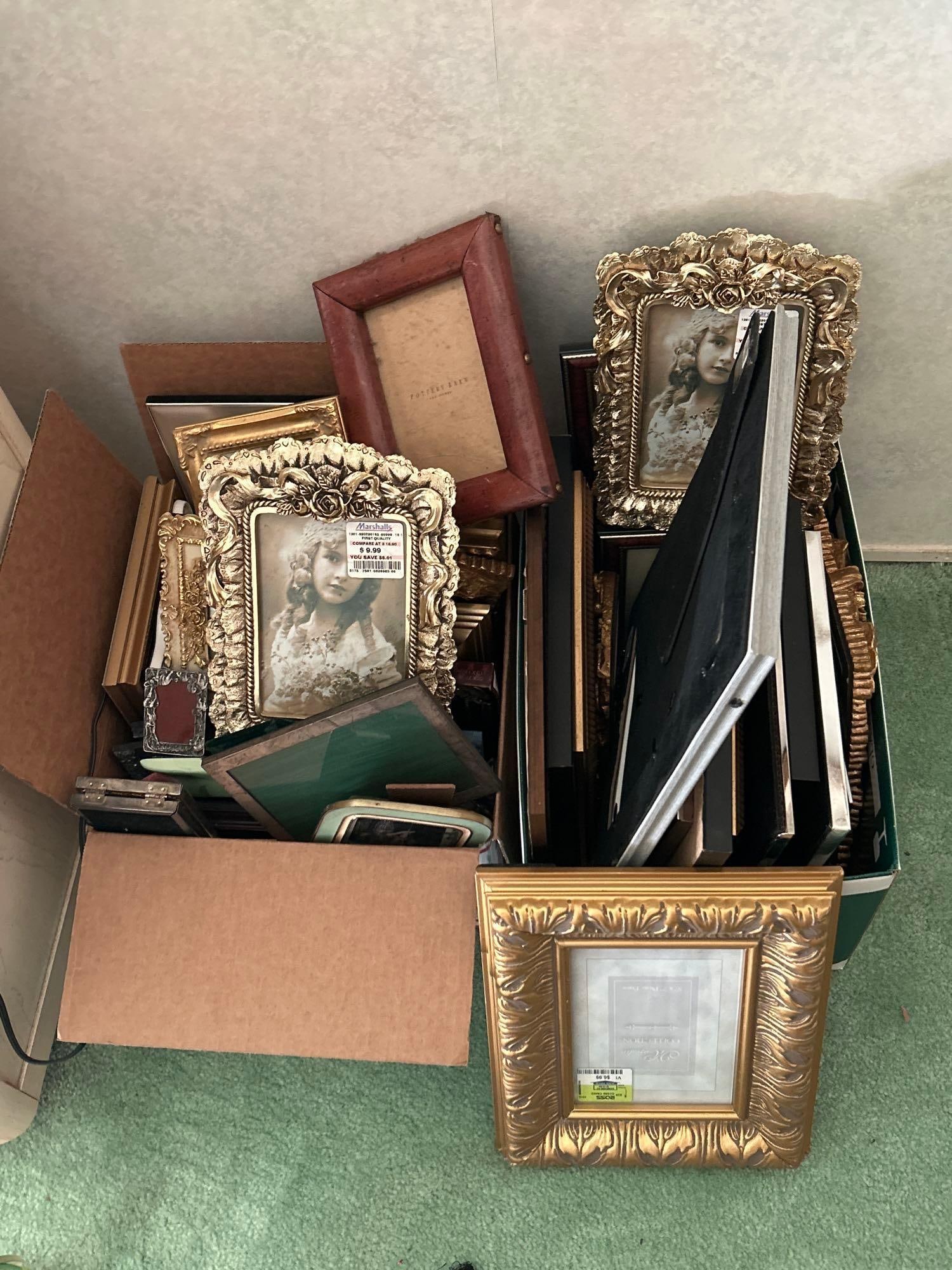 Two Boxes Of Picture Frames: Two boxes of picture frames.