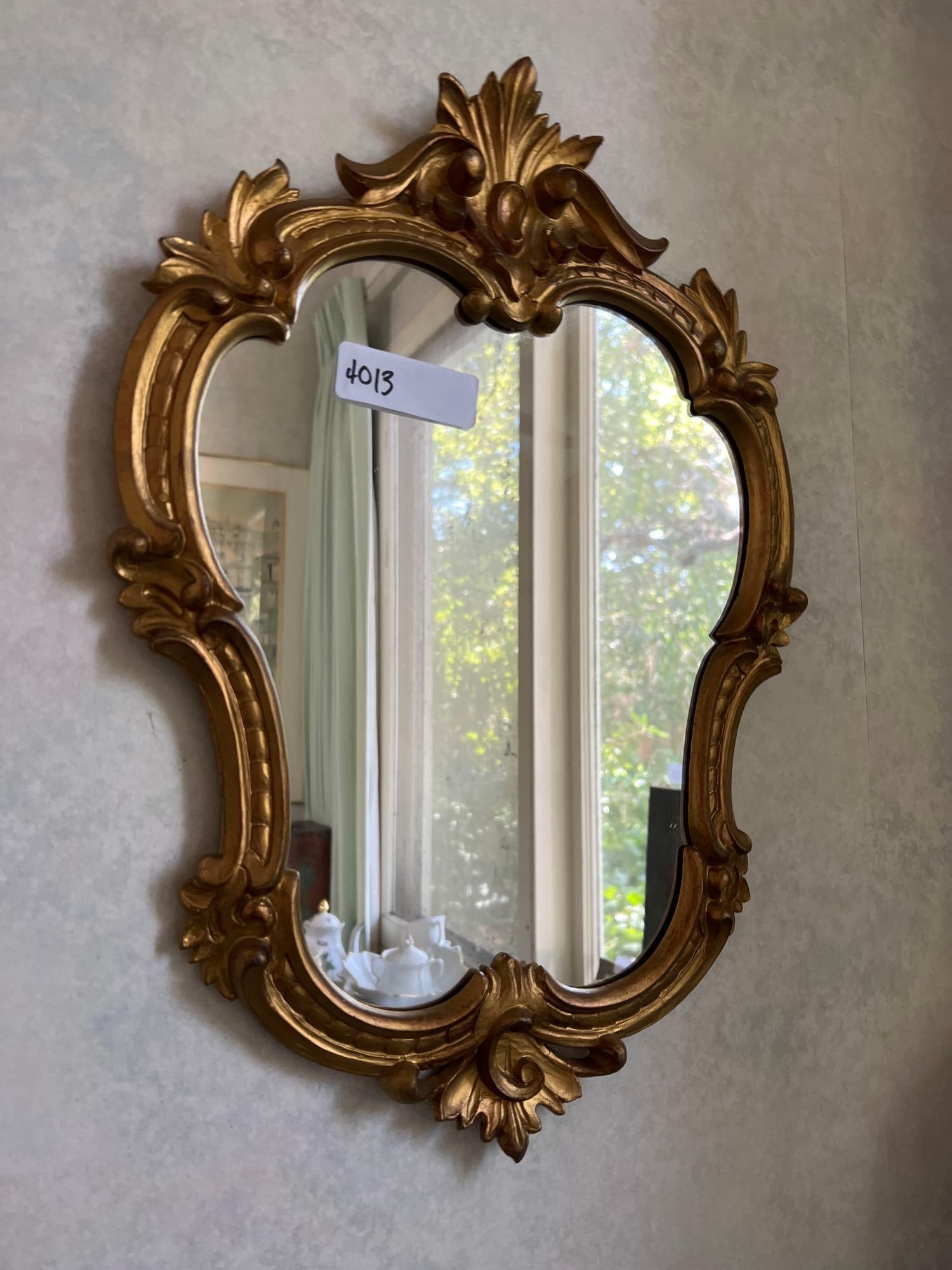 Gold Wall Mirror: Gold wall mirror.