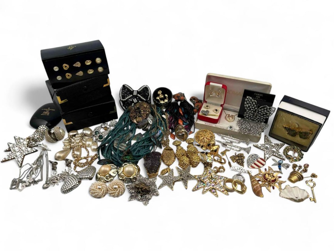 Lot Of Costume Jewelry: Lot Of Costume Jewelry. Includes earrings, bracelets, necklaces, brooches, and more.