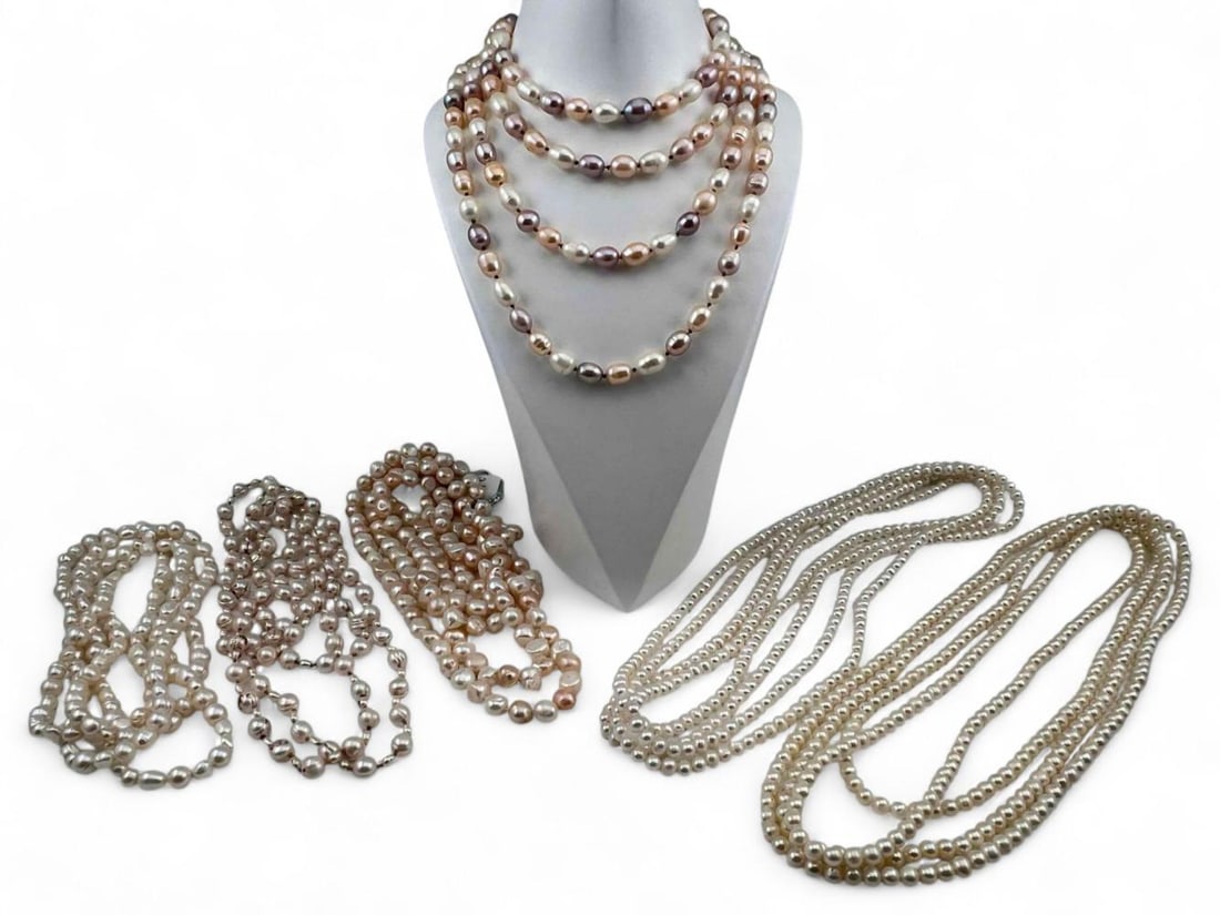 Pink & White Freshwater Pearl Jewelry: Lot Of Pink & White Freshwater Pearl Jewelry. Longest strand approximately 97.0in. Largest pearls approximately 12.5 x 9.0mm.