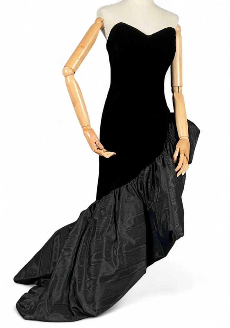 Patricia Rhodes 1980's Velvet High-Low Evening Gown: Patricia Rhodes Black 1980's Velvet Dress. Size 12. Bust approximately 36.0in. Waist approximately 28.0 inches. Total length measures 57.0in. All measurements are approximate and taken flat.