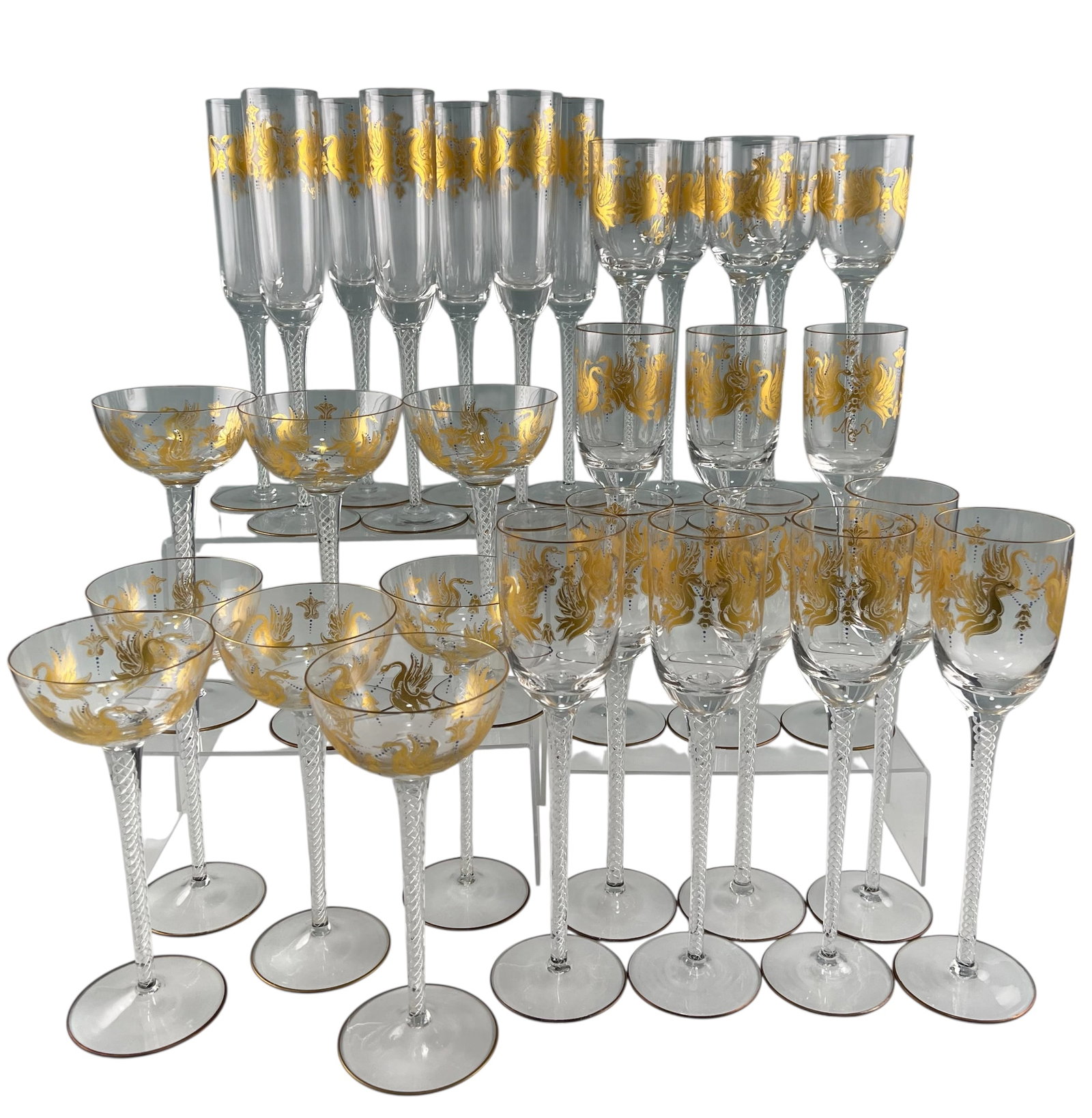 Set Of Venetian Glass Stemware: Set Of Venetian Glass Stemware. Includes fifteen wine stems, seven champagne flutes, and eight wider wine or champage glasses. Champagne flutes approximately 11.5H x 2.0W in. Wine stems approximately