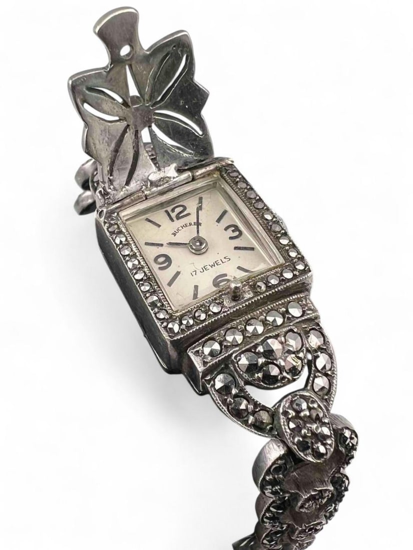 Sterling Silver Marcasite Bucherer Watch: Sterling Silver Marcasite Bucherer Watch. 27.5g. Not currently in running condition. Approximately 7.0L in. Watch face approximately 0.61L x 0.57W in. ALL CREDIT CARDS WILL BE MANUALLY VERIFIED PRIOR