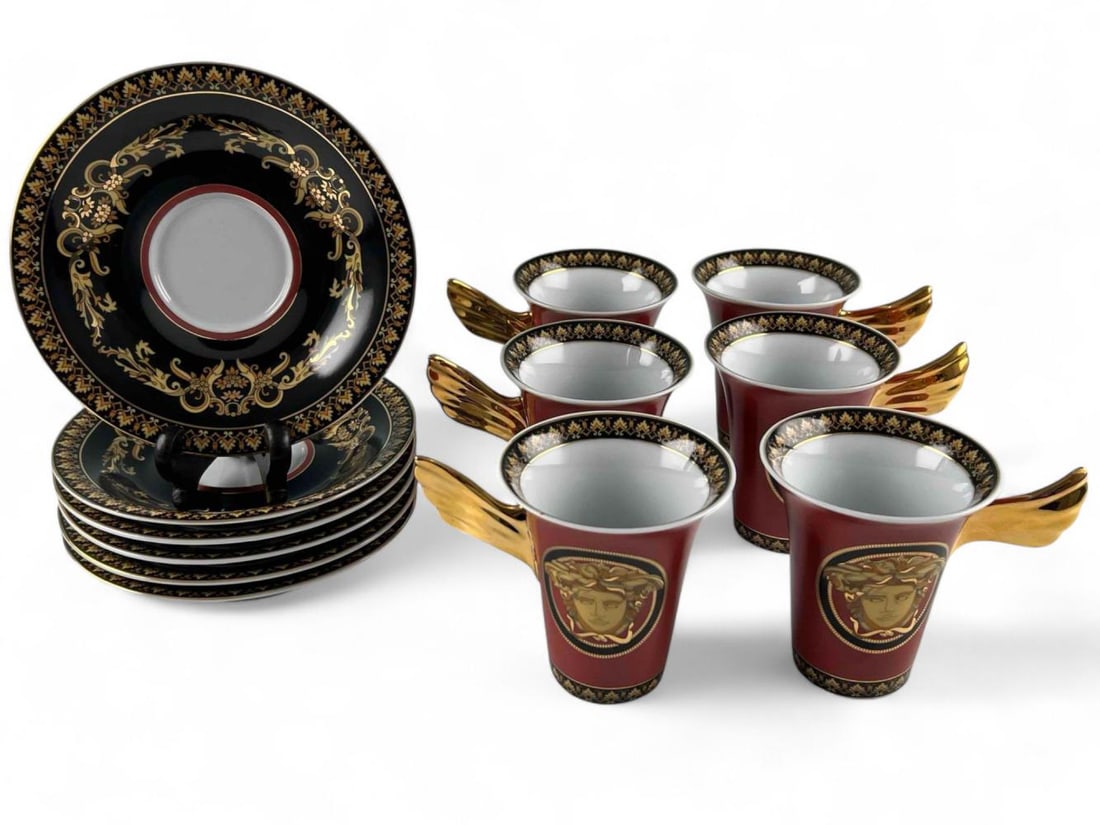 Versace Red Medusa Pocelain Demitasse Cups & Saucers, Set Of Six: Versace Red Medusa Pocelain Demitasse Cups & Saucers, Set Of Six. Marked "Versace Medusa." Cups approximately 3.5H x 4.5L x 3.25W in. Saucers approximately 5.875in.