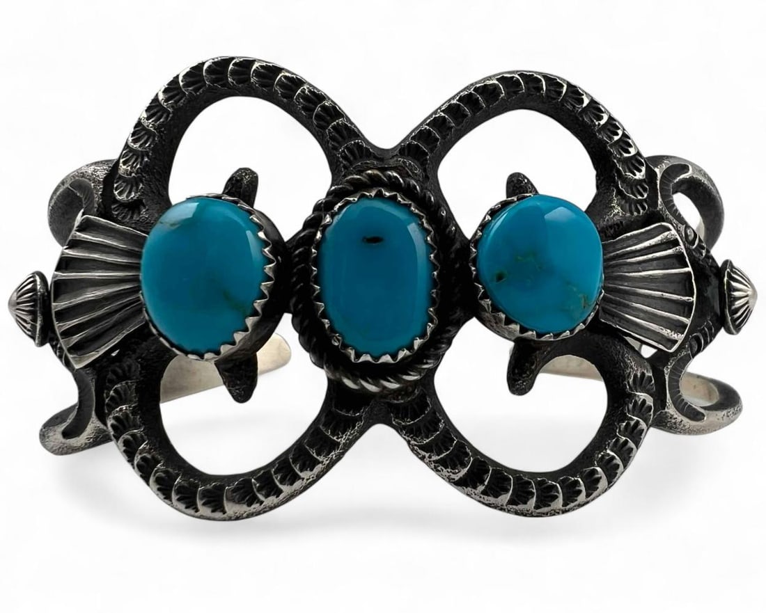 Navajo Sand Cast Sterling Silver Turquoise Cuff Bracelet: Navajo Sand Cast Sterling Silver Turquoise Cuff Bracelet, 39.7g. Signed "EL." Marked "Sterling." Inner cuff approximately 5.5in. Cuff break approximately 1.0in. Width at front approximately 1.375in.