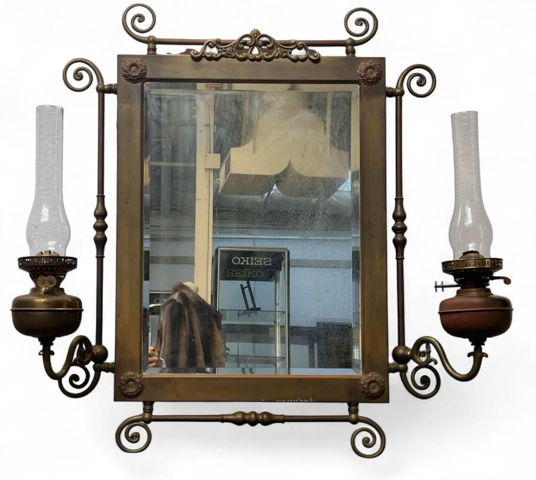 Victorian Brass Mirror With Oil Lamps: Victorian Brass Mirror With Oil Lamps. Arms adjustable. Mirror with arms extended approximately 42.0W x 36.0H x 6.0D. Not extended approximately 36.0H x 30.5W x 7.0D.