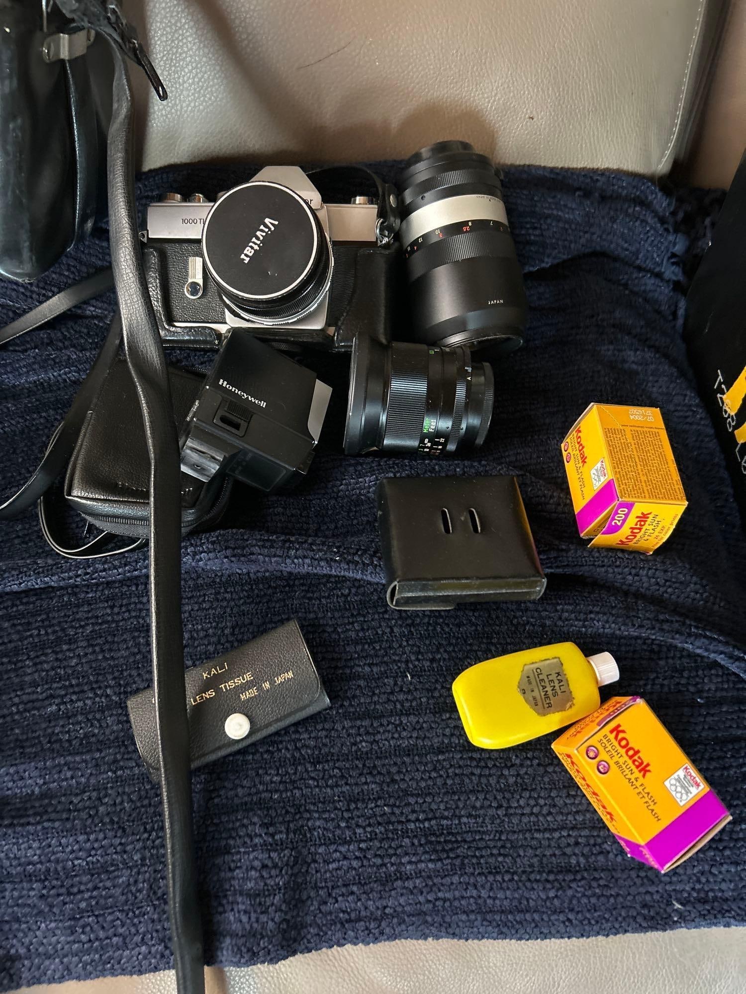 Vivitar 35 Mm Camera And Accessories To Include Telephoto Lens: Vivitar 35 mm camera and accessories to include telephoto lens.