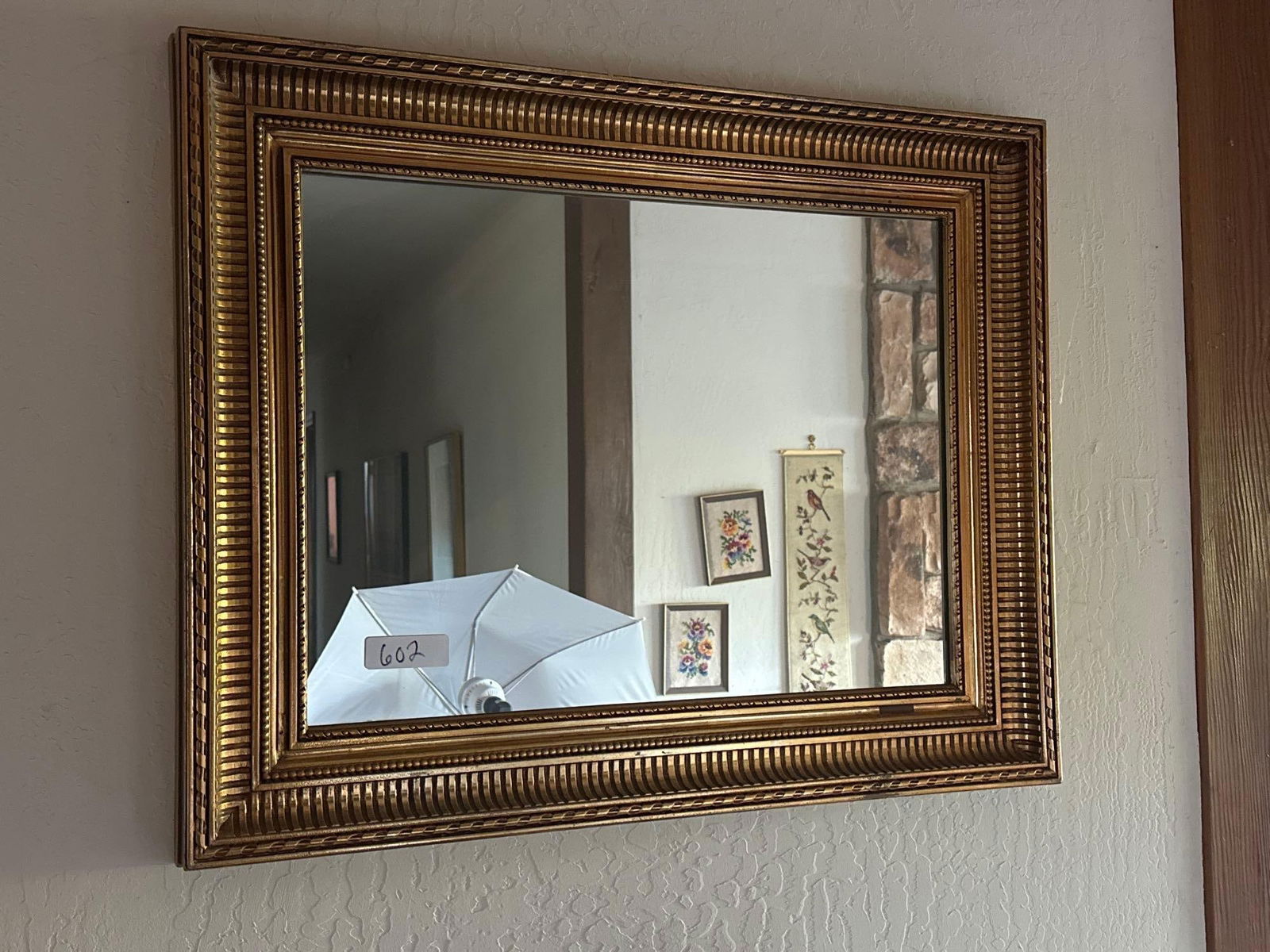 Gilt Wall Mirror: Gilt wall mirror.