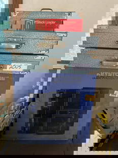 Keystone Slide Projector With Slides: Keystone slide projector with slides. Slide boxes labeled "West Germany." Projector is in box and has not been tested.