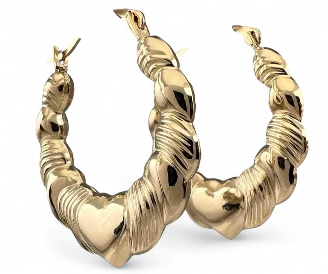 14K Gold Heart Hoop Earrings: 14K Gold Heart Hoop Earrings, 1.1g. Marked 14K. Approximately 22.0L x 3.3W mm. ALL CREDIT CARDS WILL BE MANUALLY VERIFIED PRIOR TO SHIPMENT.