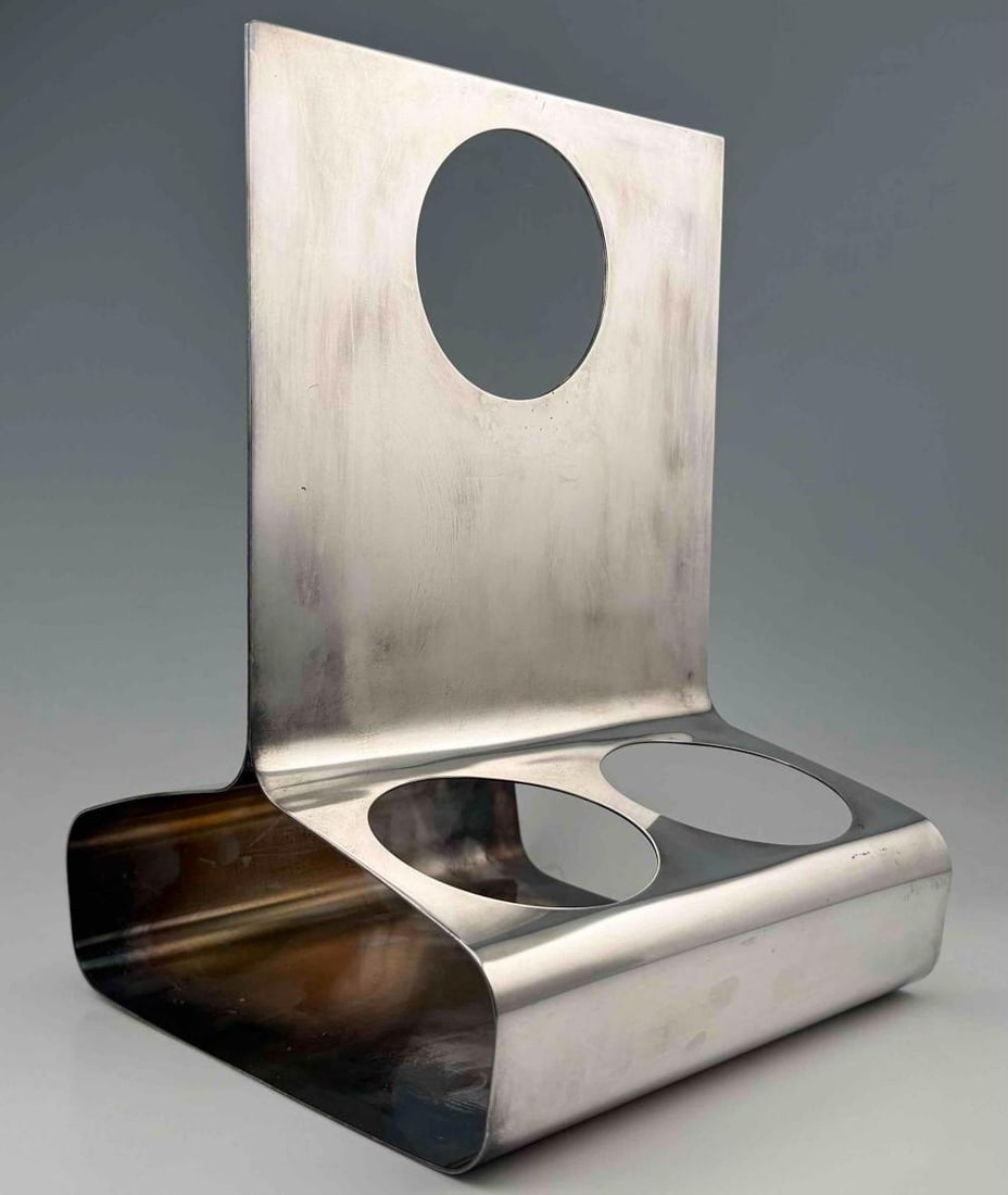 Lino Sabattini Silver Plate Wine Bottle Holder: Lino Sabattini Silver Plate Mid Century Modern Wine Bottle Holder. Marked "Sabattini Made In Italy." Approximately 12.5H x 8.625W x 9.0D in.FOR SHIPPING: You may reach out to: QPS info@qualitypackship