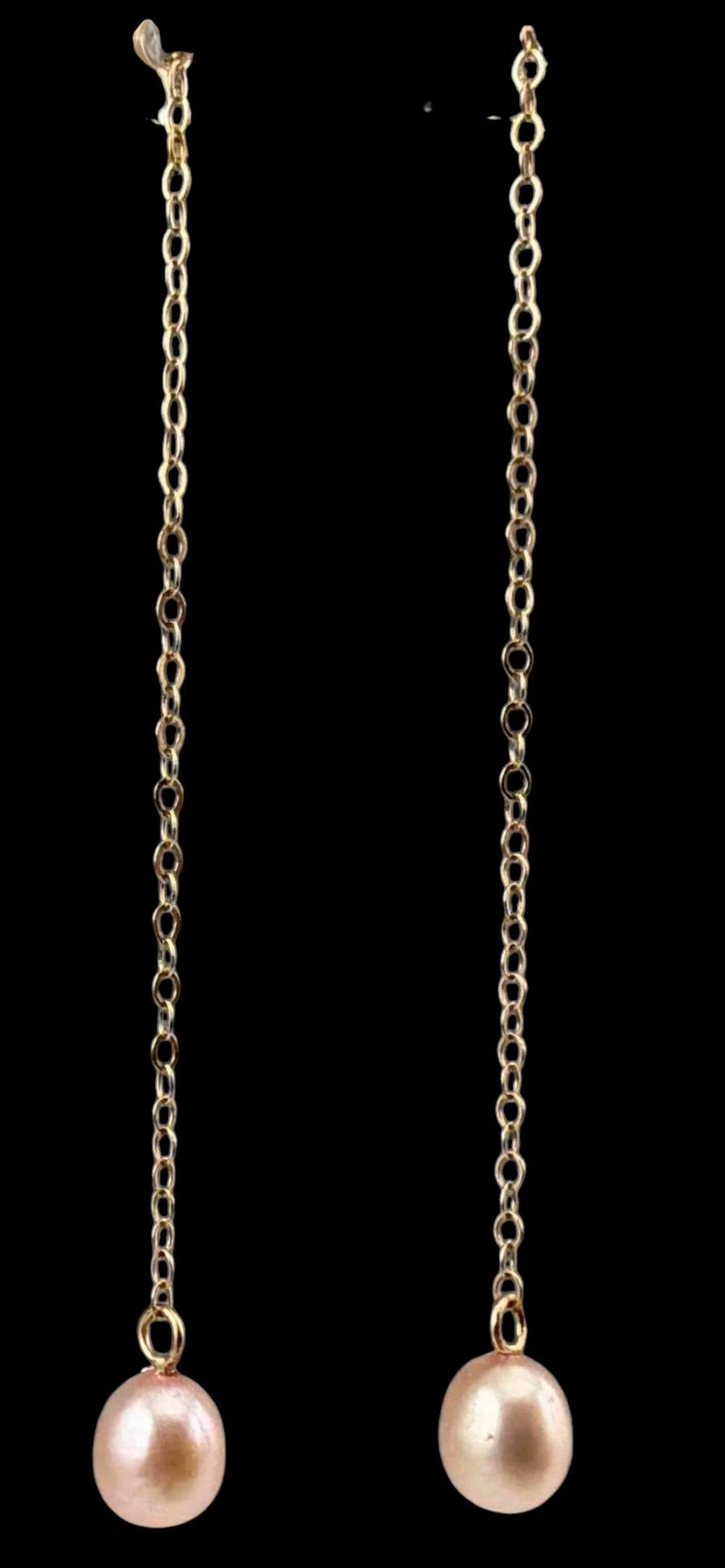 14K Pearl Dangle Earrings: 14K Pearl Dangle Earrings, 1.2g. Marked 14K. Length approximately 2.35in. Pearls approximately 6.5 x 5.4mm. ALL CREDIT CARDS WILL BE MANUALLY VERIFIED PRIOR TO SHIPMENT.FOR SHIPPING: You may reach out