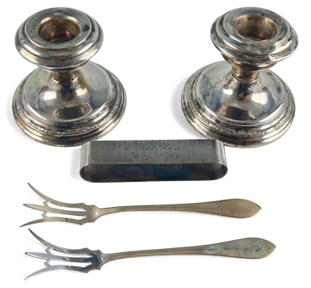 Lot Of Sterling Silver Tableware: Lot Of Sterling Silver Tableware. Weight excluding candlesticks 51.0g. Marked "Sterling." Candlesticks marked "Sterling Weighted." Please note one candlestick is in fragile condition at center (as pho