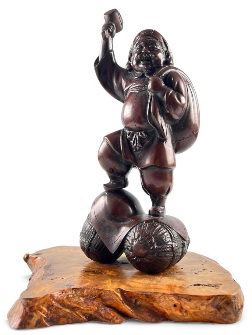 Japanese Bronze Sculpture Of Daikokuten: Japanese Bronze Sculpture Of Daikokuten, Ca. Late 19th-Early 20th C. Mounted On Burlwood Base. Sculpture approximately 11.0H x 4.5W x 3.5D in. As mounted approximately 12.0H x 10.0W x 8.25D in.FOR SHI