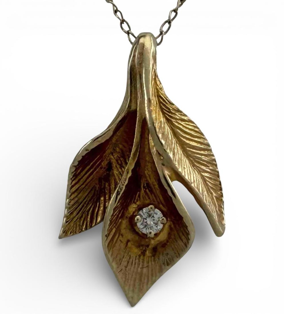 14K Diamond Calla Lily Necklace: 14K Diamond Calla Lily Necklace, 2.0g. Chain marked 14K. Pendant unmarked, tests as 14K. Chain length approximately 20.25in. Pendant approximately 21.5 x 13.0mm. ALL CREDIT CARDS WILL BE MANUALLY VERI