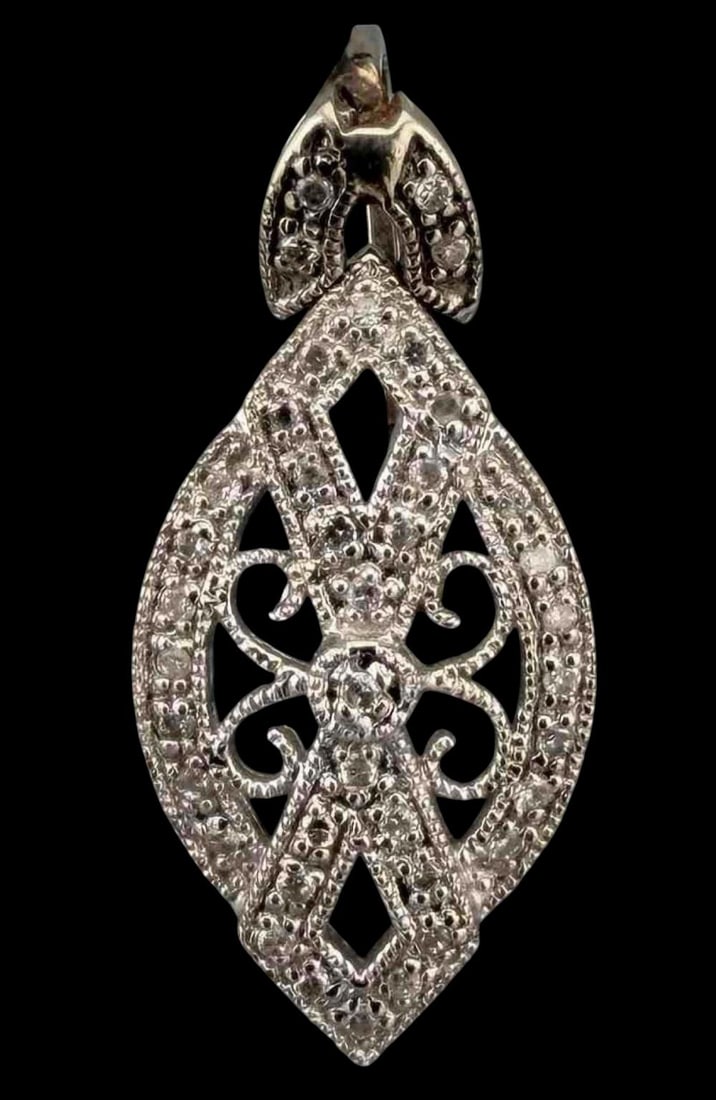 14K White Gold Diamond Pendant: 14K White Gold Diamond Pendant, 2.2g. Unmarked, tests as 14K. Approximately 25.0 x 11.5mm. ALL CREDIT CARDS WILL BE MANUALLY VERIFIED PRIOR TO SHIPMENT.