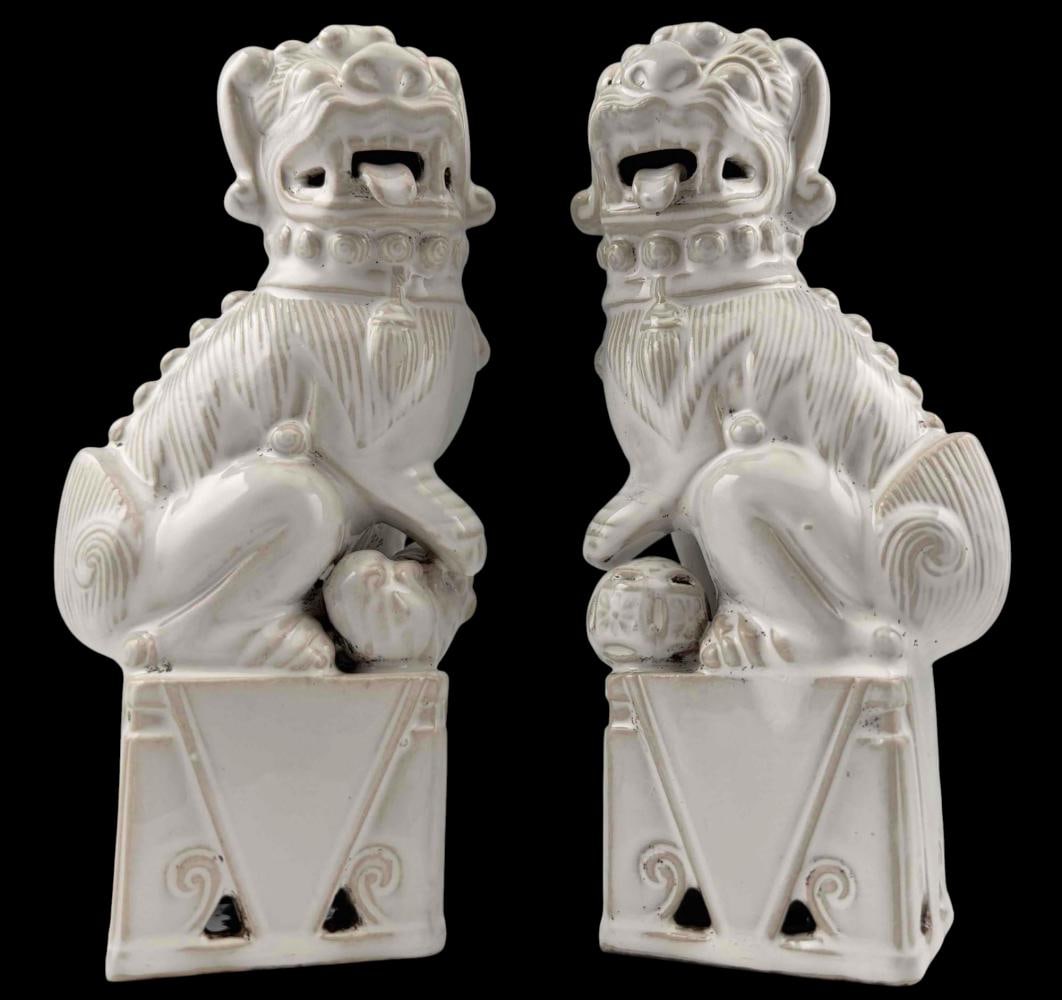 Pair Of White Glazed Porcelain Foo Dogs: Pair Of White Glazed Porcelain Foo Dogs. Marked "Japan." Approximately 9.25H x 4.0W x 3.125D in. Marked "Japan."