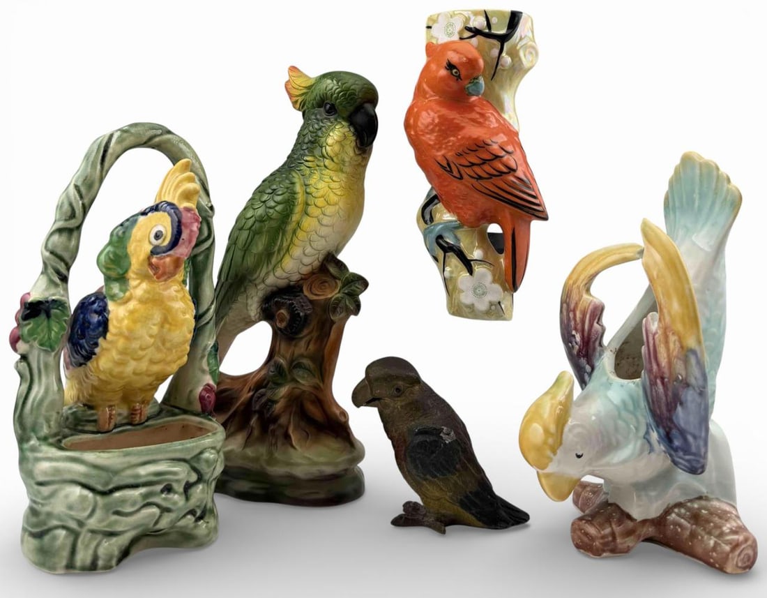 Grouping Of Ceramic & Metal Parrot Figures: Grouping Of Ceramic & Metal Parrot Figures. Largest approximately 10.25H x 4.25W x 2.75D in. Smallest approximately 3.5H x 3.5L x 1.875W in.