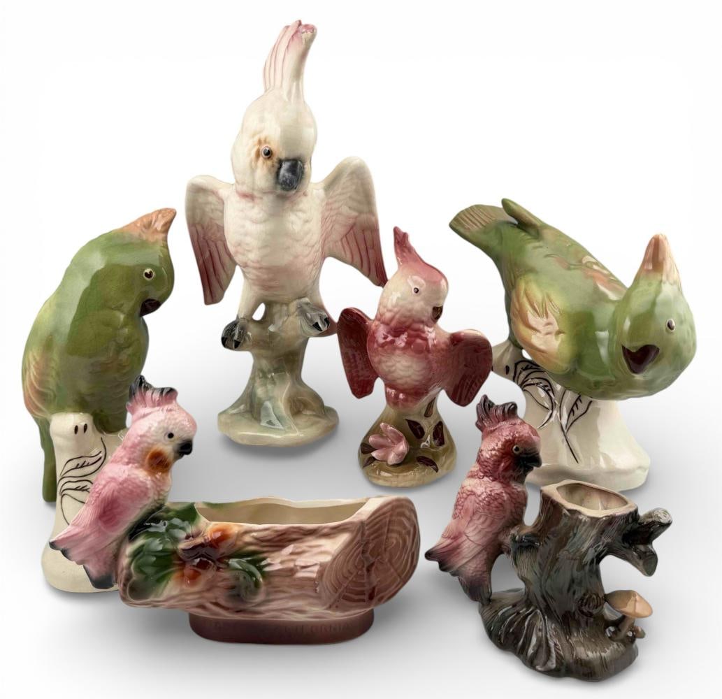 Grouping Of Mid Century California Pottery Cockatoo Figures: Grouping Of Mid Century California Pottery Cockatoo Figures. Large green pair marked "Modglin's Los Angeles." Largest piece approximately 10.25H x 5.625W x 5.0D in. Smallest approximately 5.625H x 5.5