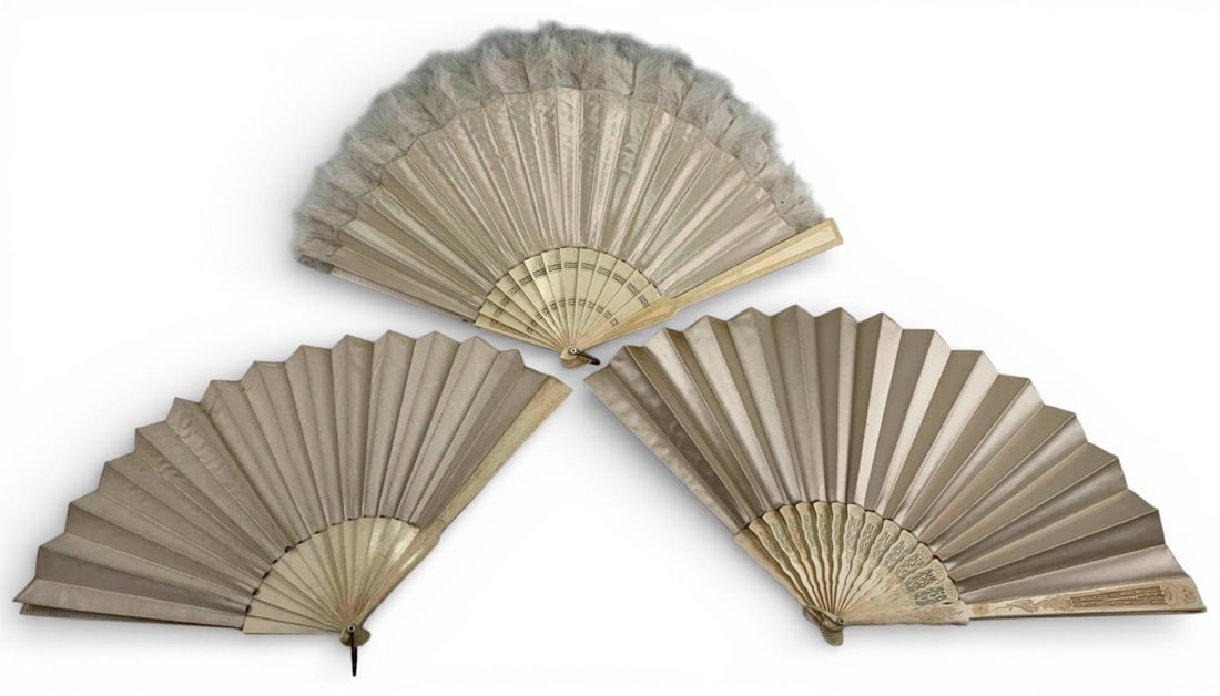 Three 19th Century White Satin Evening Fans With Carved & Pierced Bone Sticks & Guards: Three 19th Century White Satin Evening Fans With Carved & Pierced Bone Sticks & Guards. Largest: Guards approximately 12.75L x 1.0W in., width when opened approximately 24.0in. Smallest: Guards approx