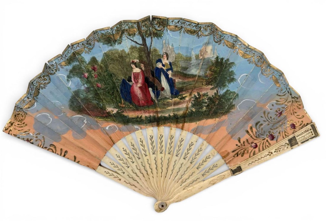 Early 19th Century Hand Colored Engraved Fan: Early 19th Century Hand Colored Engraved Fan. A Regency–early Victorian fan featuring a printed engraved leaf finely hand-colored with gilt embellishments and decorative borders. Carved and engr
