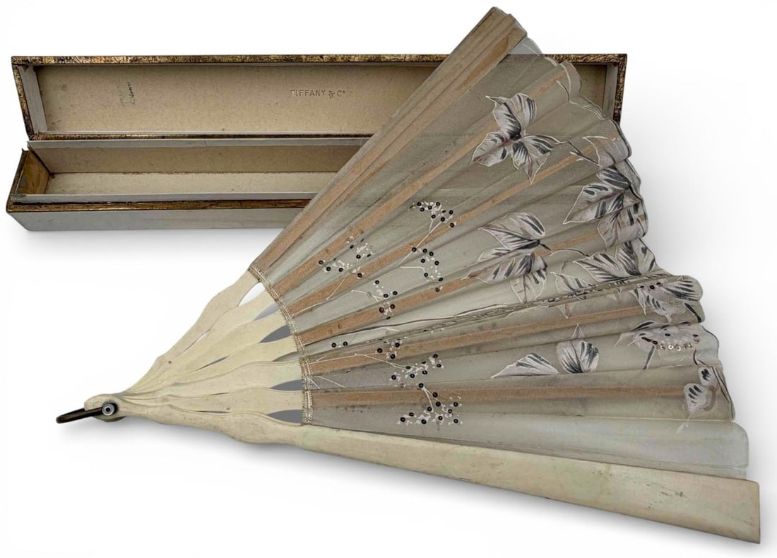 Tiffany & Co. Hand Painted Silk & Bone Fan With Box: Tiffany & Co. Hand Painted Silk & Bone Fan With Box. Approximately 23.5W x 12.75H in. Guards approximately 12.75L x 1.0W in. Box approximately 14.625L x 2.0W x 1.875H in.
