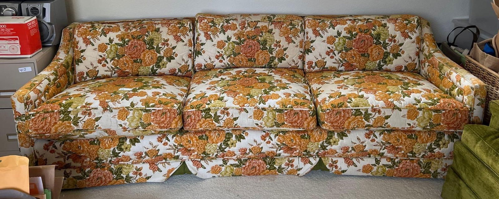 Mid-Century Orange Floral Three Seat Sofa: Mid-century orange floral three seat sofa.