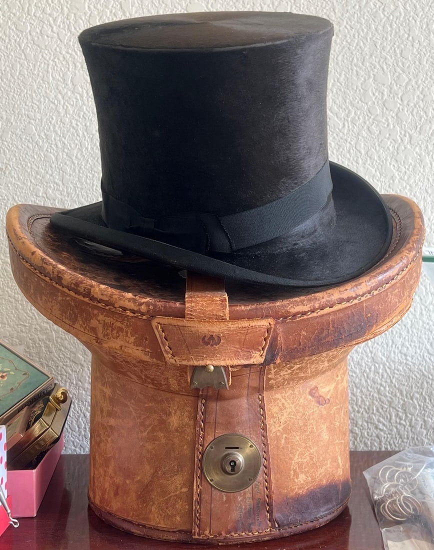 Antique Top Hat With Leather Case: Antique top hat with leather case.