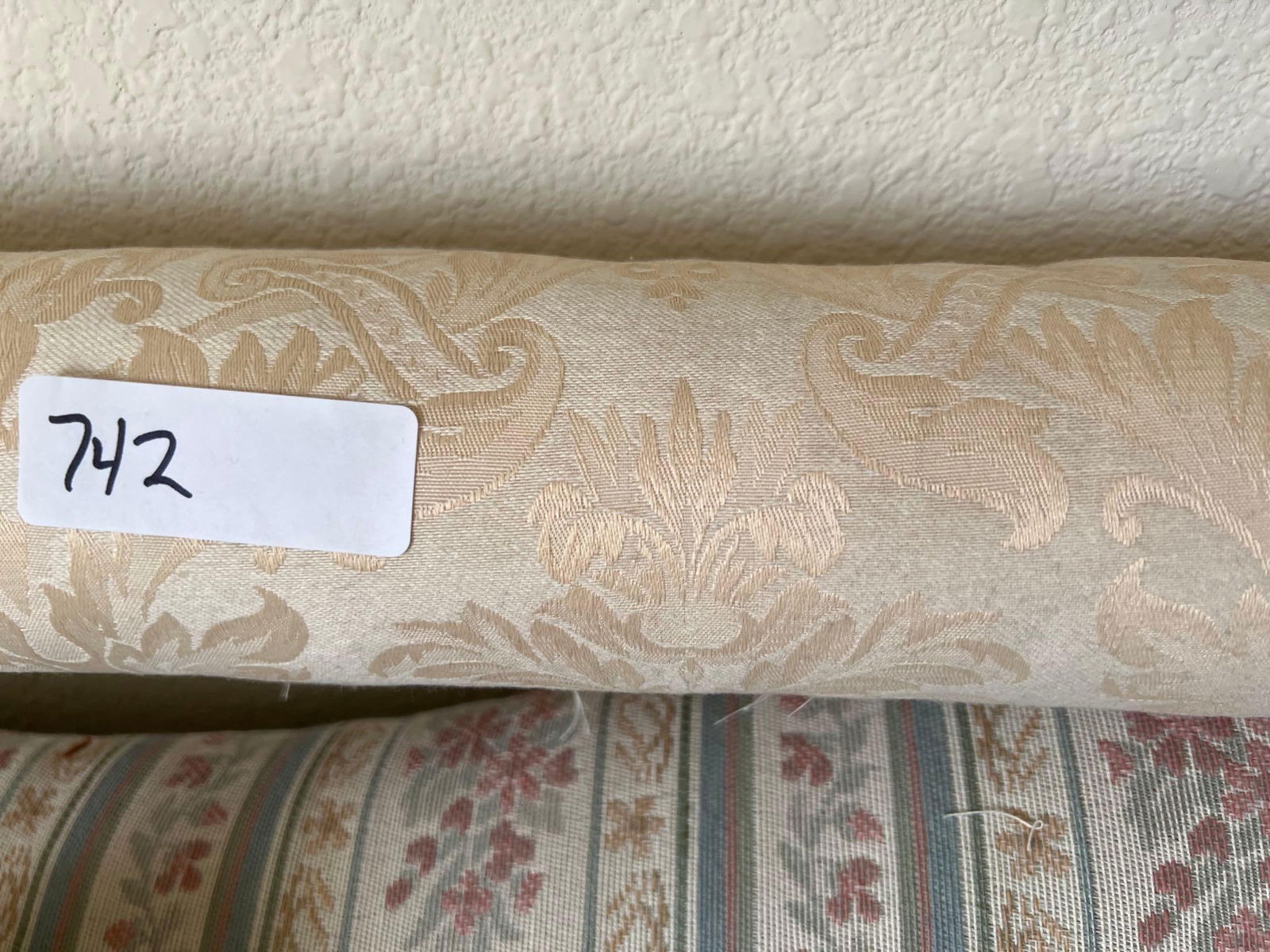 Roll Of Ivory Colored Upholstery Fabric: Roll of ivory colored upholstery fabric. Several yards.