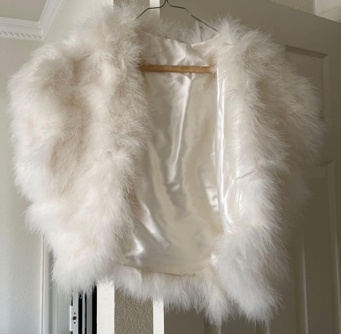 Cropped White Ostrich Feather Bolero With Cap Sleeves: Cropped white ostrich feather bolero with cap sleeves. Approximate size small.