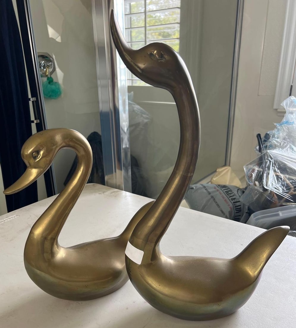 Pair Of Brass Geese: Pair of brass geese. Larger approximately 19 in high.