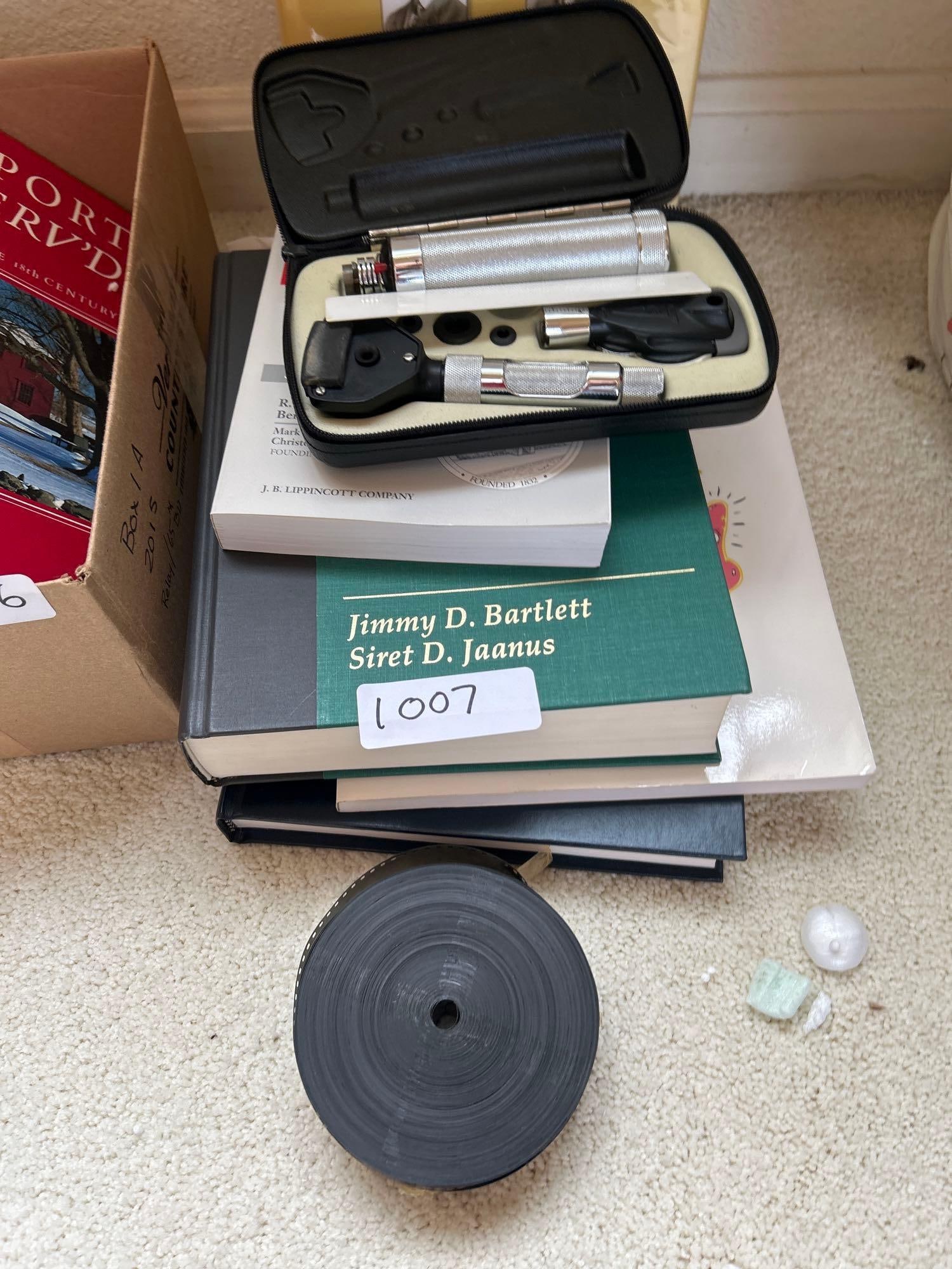 Lot Of Optometry Medical Books And Equipment: Lot of optometry medical books and equipment. Includes roll of film with close-up images of eyes.