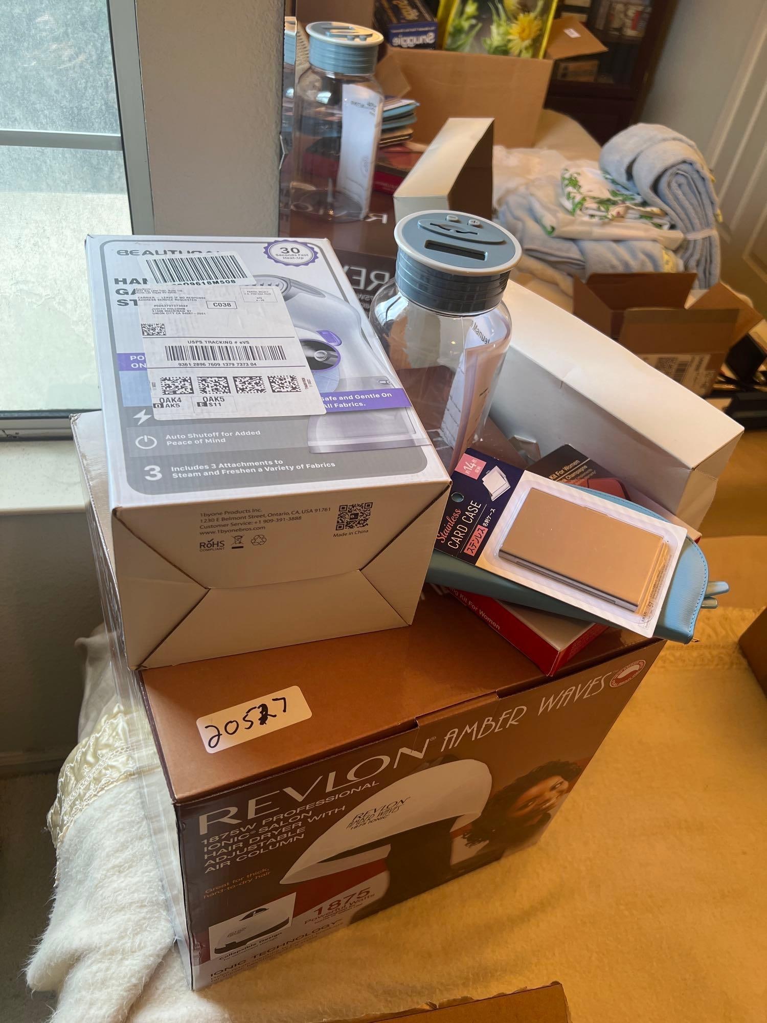 Revlon Hairdryer, Nail Kit And Clothing Steamer: Revlon hairdryer, nail kit and clothing steamer.