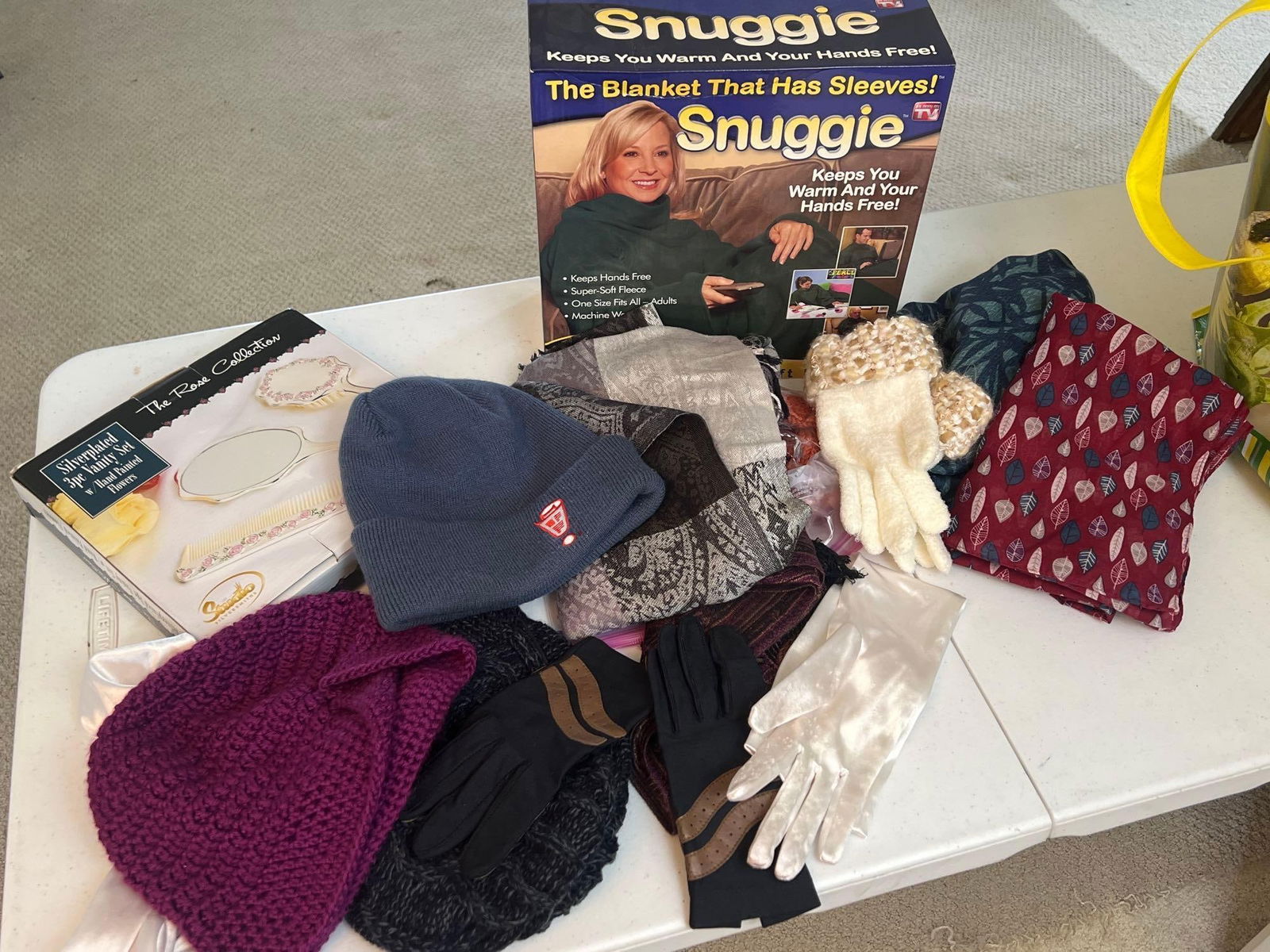 Large Grouping Of Women's Scarves, Hats, Slippers, And Snuggie Blanket: Large grouping of women's scarves, hats, slippers, and snuggie blanket.