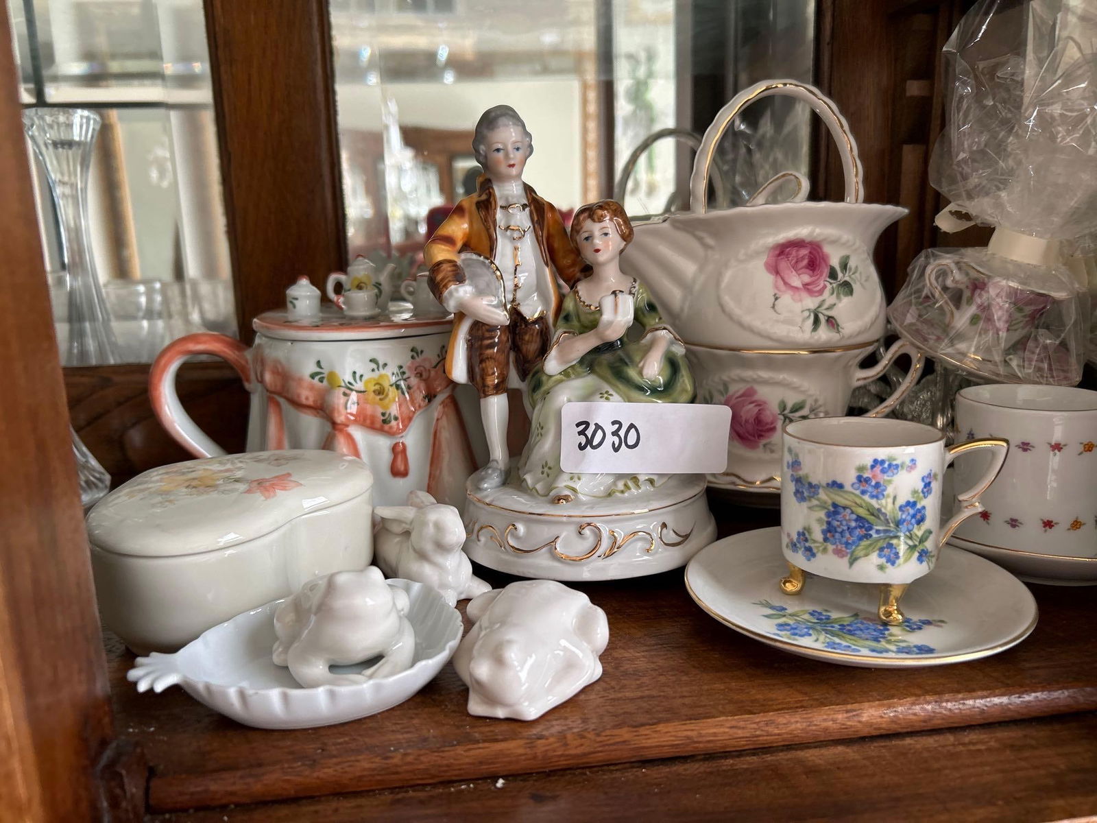 Porcelain Teapots, Music Box, And Decorative Items: Porcelain teapots, music box, and decorative items.