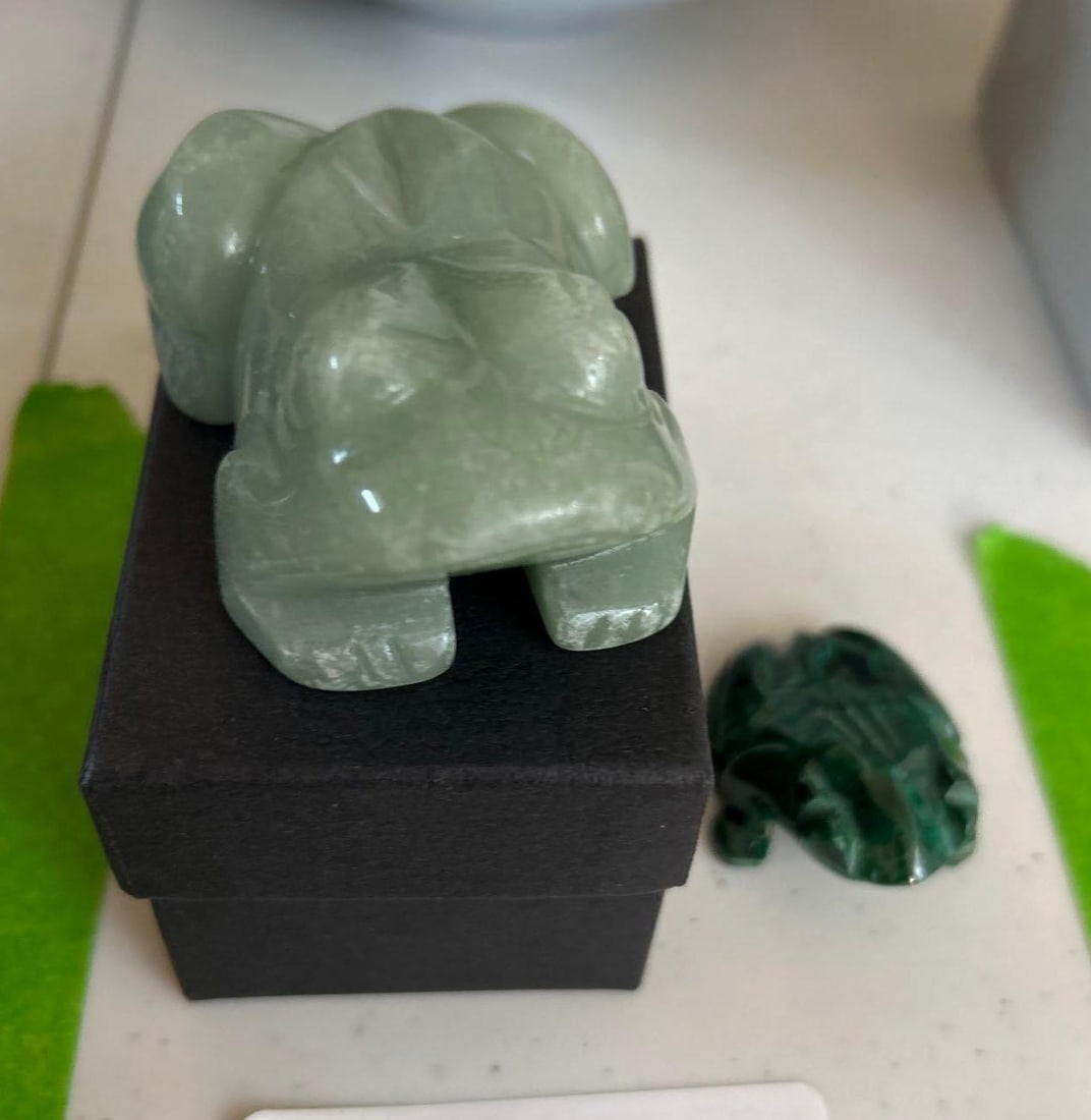 Carved Jade And Malachite Frog Figures: Carved Jade and Malachite frog figures.