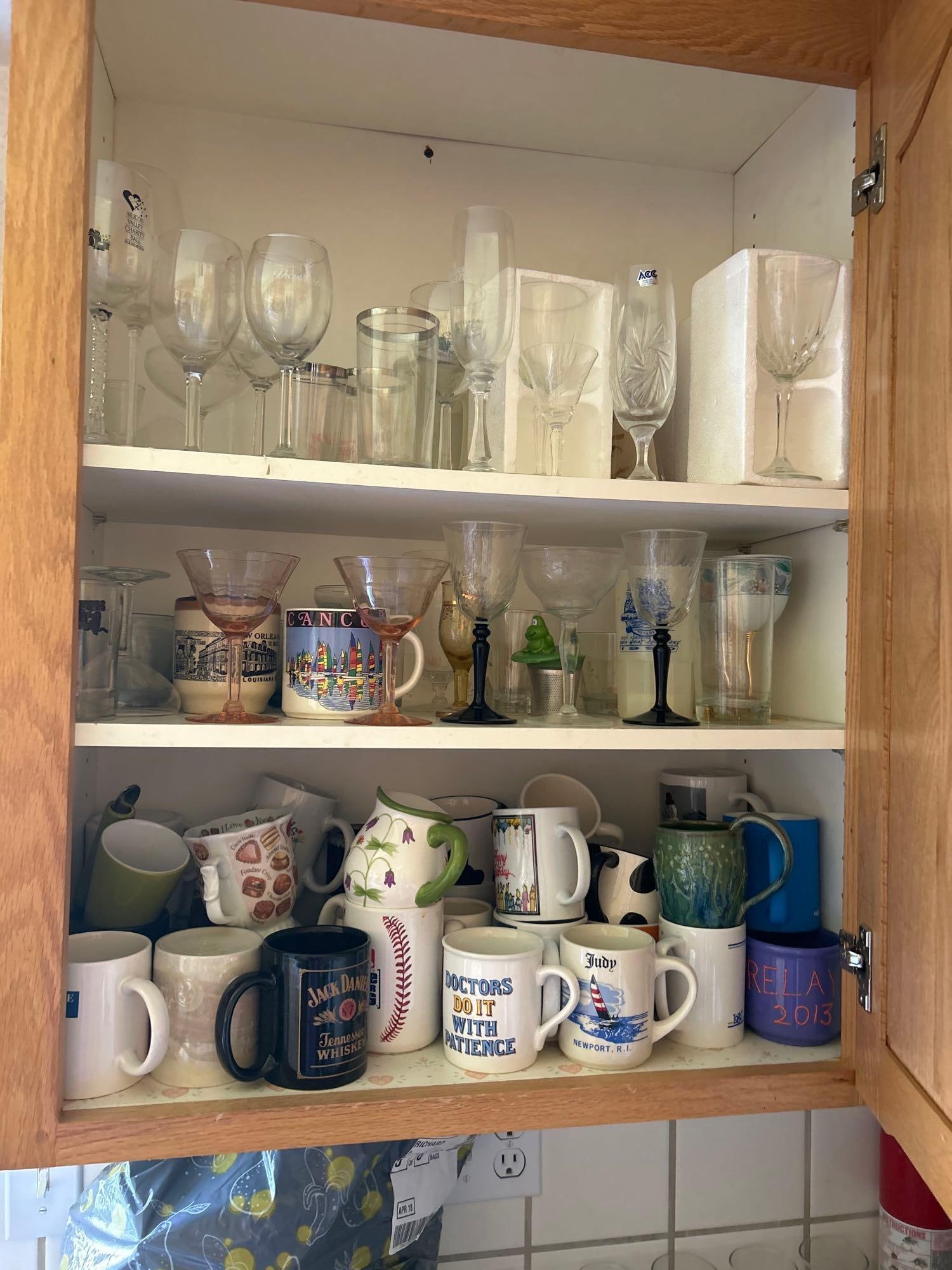 Cupboard Of Vintage Glassware And Coffee Cups: Cupboard of vintage glassware and coffee cups.