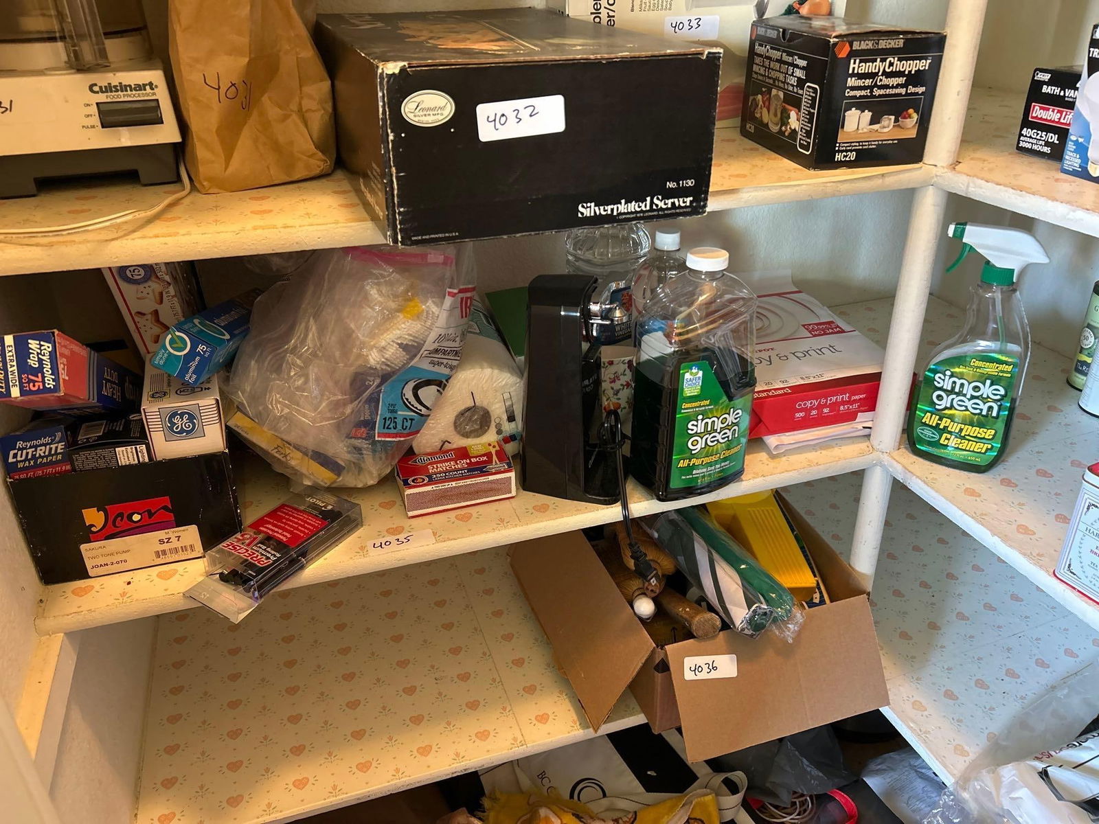 Shelf Of Cleaning Supplies, Tinfoil, Light Bulbs, Printer Paper, Coffee Cups, And Garbage Bags (1 of 5)