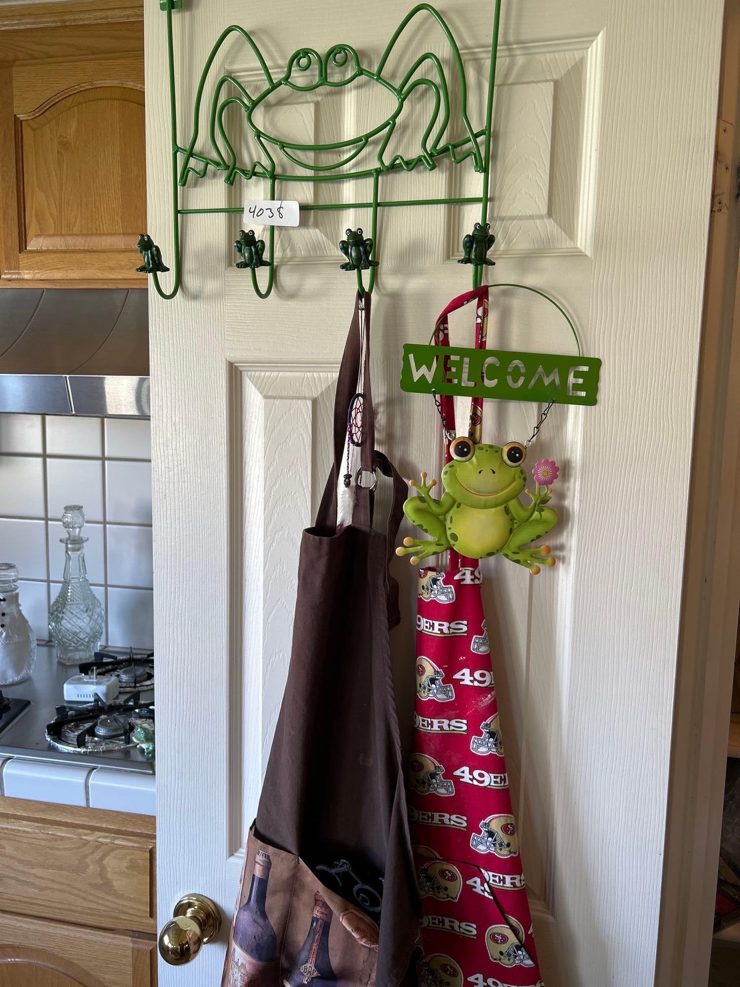 Frog Hanging Hook, Welcome Sign, And Aprons: Frog hanging hook, welcome sign, and aprons.